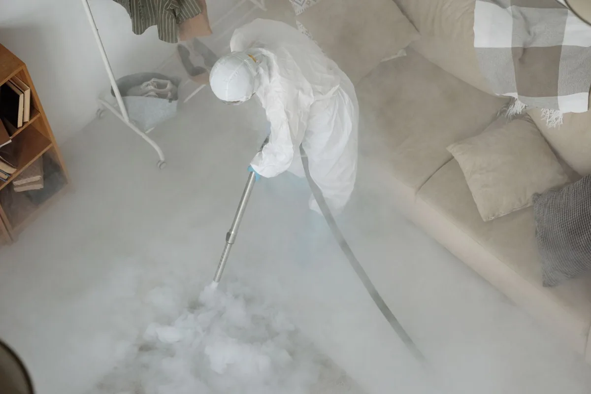 Biohazard cleanup technician in protective equipment, Jupiter Farms, FL